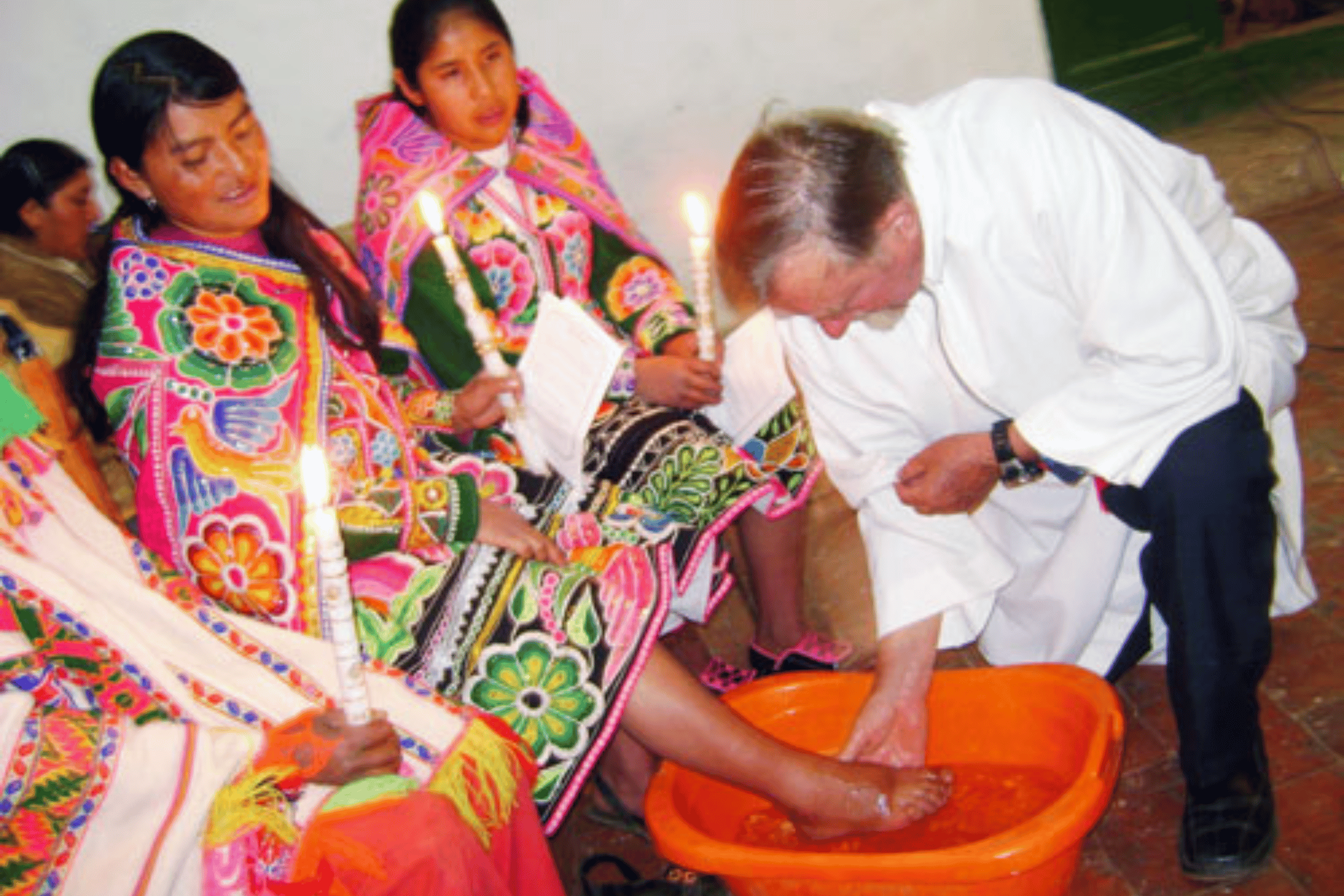 Fr Don Hornsey SSC washing the feet. Photo: St Columbans Mission Society