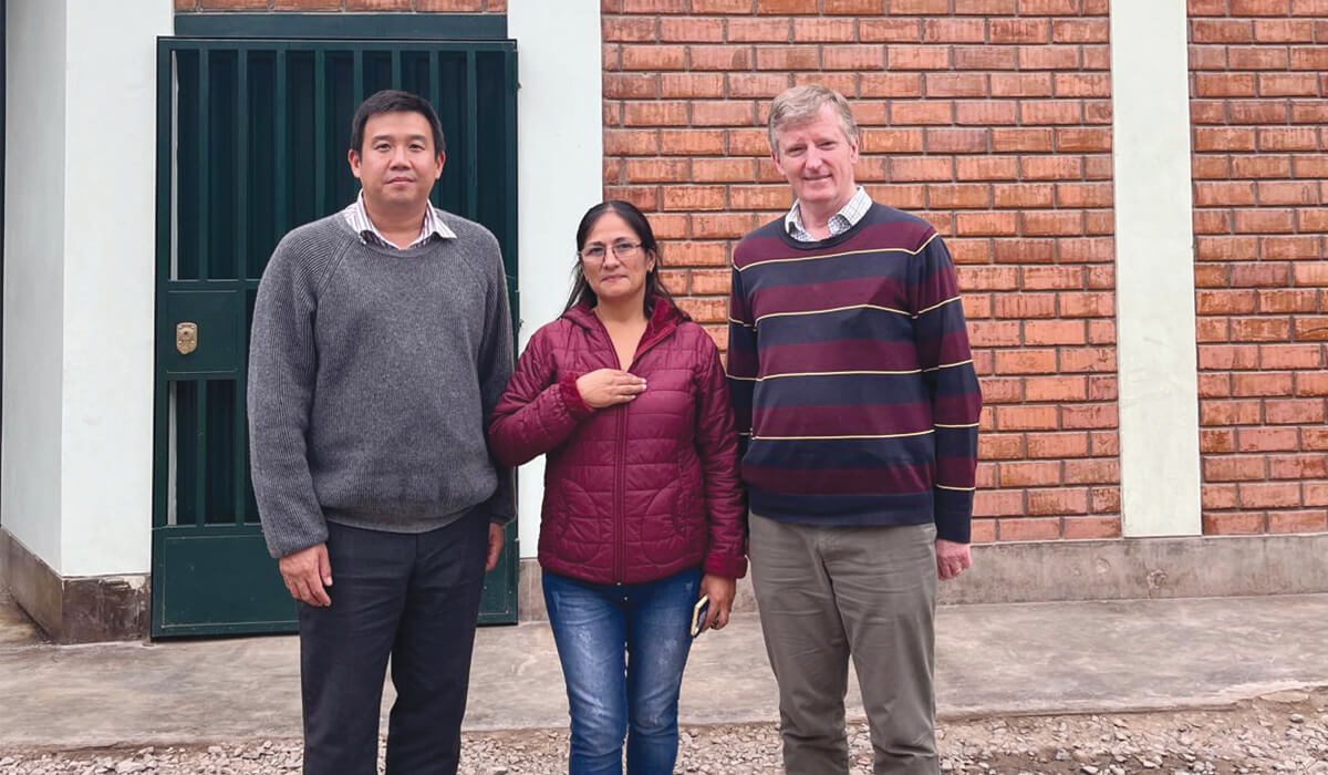 Columban Frs Carlo Jung (left) and Peter O’Neill (right) together with Ruth Malpartida in front of St Bernadette’s Remedial School in Lima, Peru. - Photo: Fr Peter O'Neill