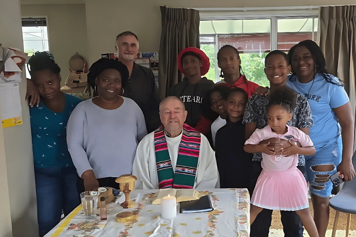 Fr Don Hornsey with Columbian refugees in Levin. Photo: Fr Don Hornsey