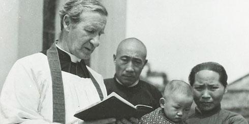 Co-Founder, Columban Fr Edward Galvin baptising a child in China.
