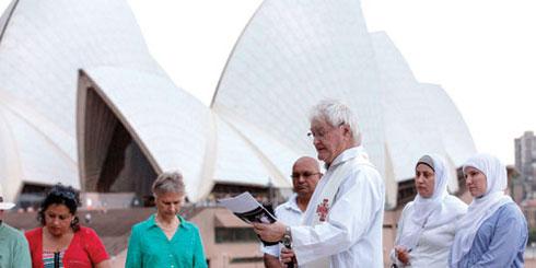 Columban Fr Charles Rue offering prayer at the Multi-faith Prayer Vigil for Climate Action in Sydney. (Photo Credit: Jeff Tann. Vigil event organised by the Australian Religious Response to Climate Change (ARRCC) in partnership with the Faith Ecology Network (FEN) and Catholic Earthcare Australia).